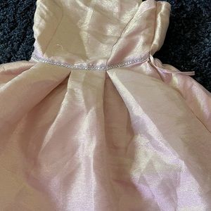 Girls dress in pink with gold